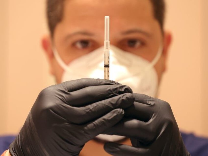 Jatniel Hernandez fills syringes with COID-19 vaccine booster shots at a COVID-19 vaccination clinic on April 06, 2022 in San Rafael, California. The U.S. Food and Drug Administration has authorized a second COVID-19 booster of Pfizer-BioNTech and Moderna vaccines for people over 50 years old four months after their first …