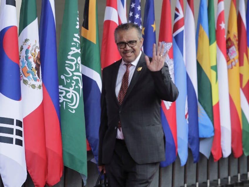 World Health Organization (WHO) Director-General Tedros Adhanom Ghebreyesus waves he arriv