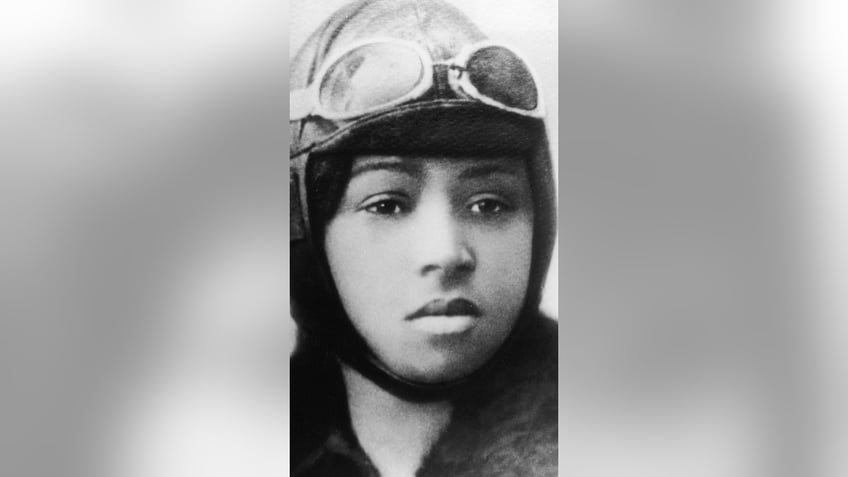 Bessie Coleman wearing flying helmet and goggles