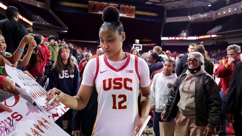 JuJu Watkins signs autographs