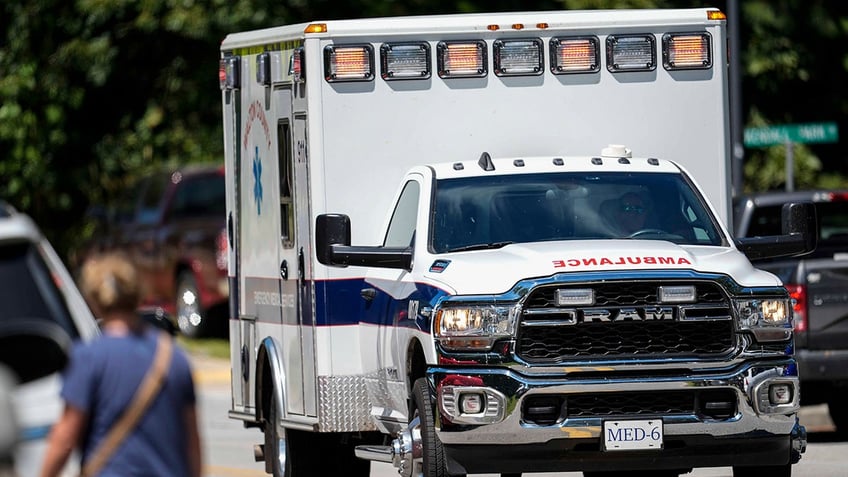 An ambulance departs Apalachee High School after a shooting at the school