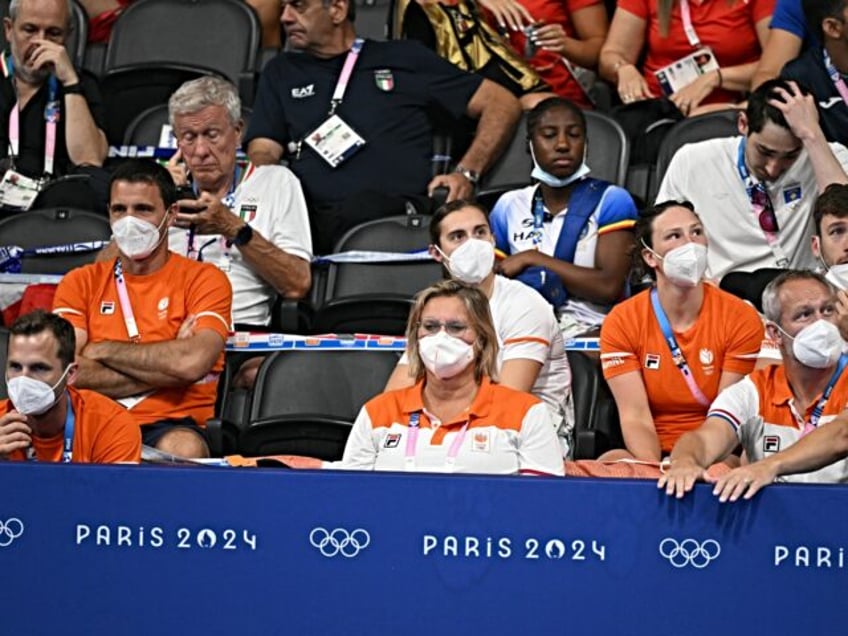 coronavirus Coaches from the Netherlands wearing face masks attend the swimming event duri