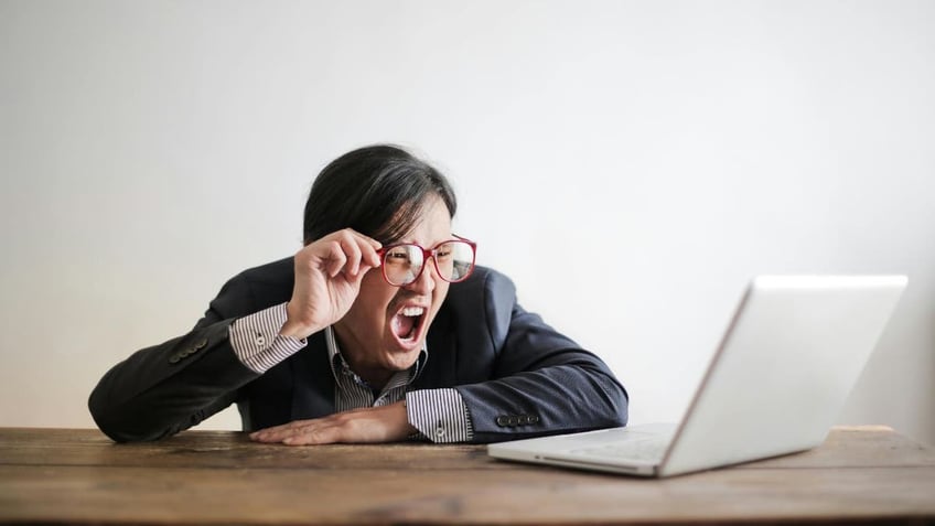 shocked man at laptop