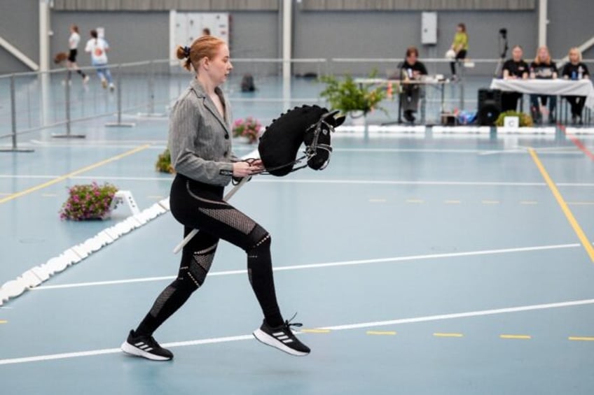 Giddy up: A rider takes part in a dressage event at the Finnish Hobbyhorse Championships