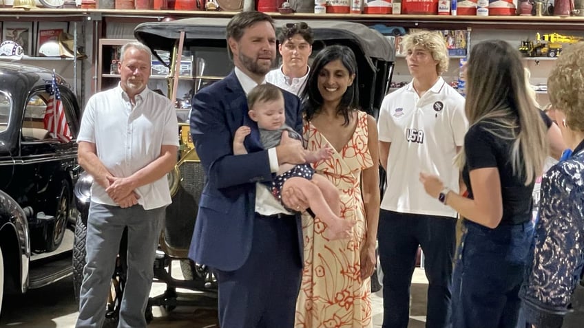 Republican vice presidential nominee Sen. JD Vance and his wife Usha meet with supporters ahead of a campaign event in Byron Center, Michigan, on Aug. 14, 2024.