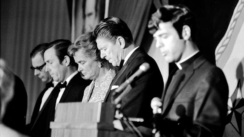 Ronald Reagan praying.