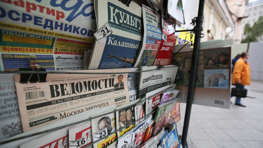 File shot showing Russian newspapers for sale at a street vendor's stall in Moscow on Wednesday, Sept. 25, 2014.