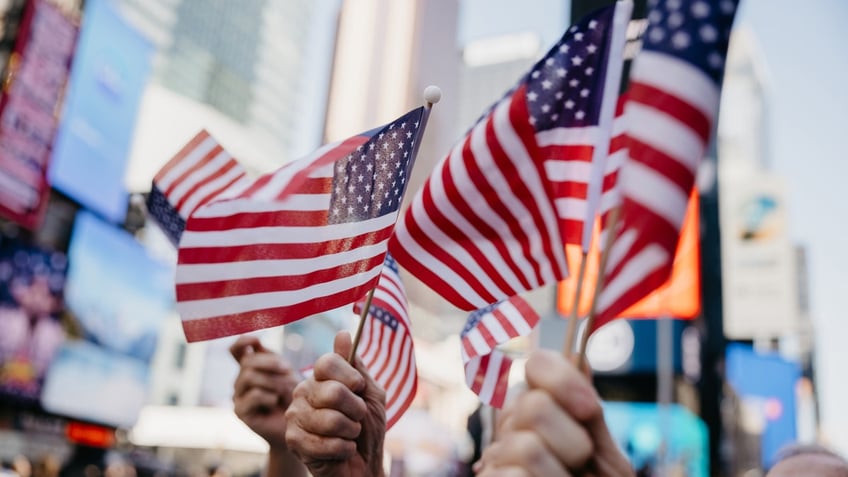 American flags being waved in NYC