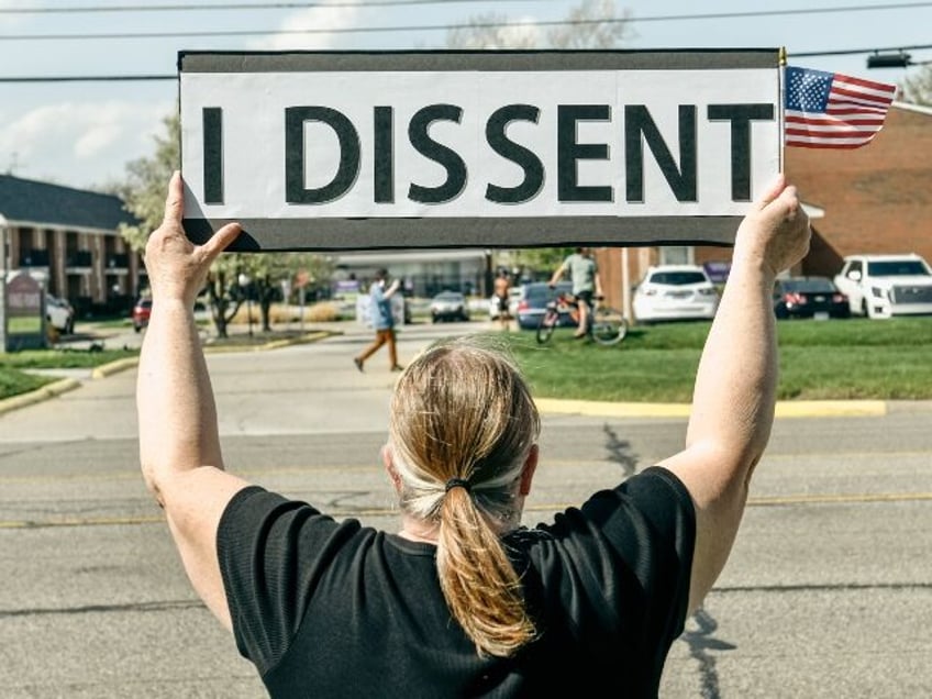 A Trump hating protester and his ponytail