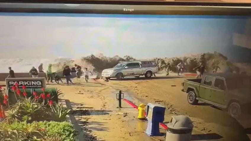 A wave crashing onto a street in California