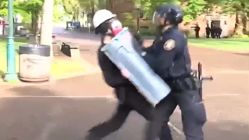 Protester charges at Portland police