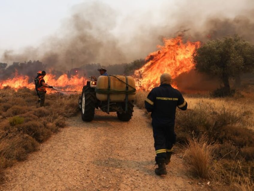 wildfires continue to rage in greece authorities announce evacuations