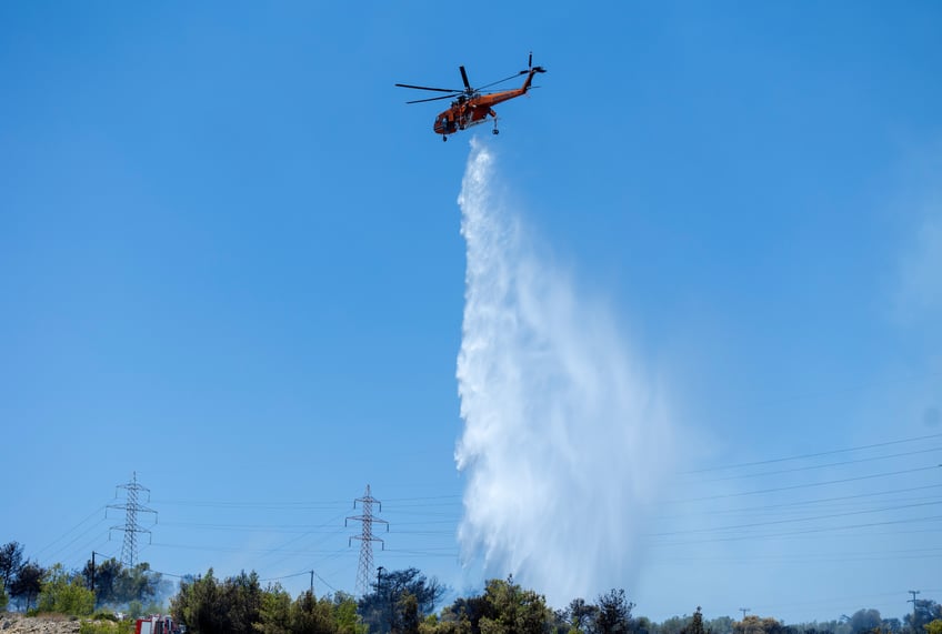 wildfires continue to rage in greece authorities announce evacuations