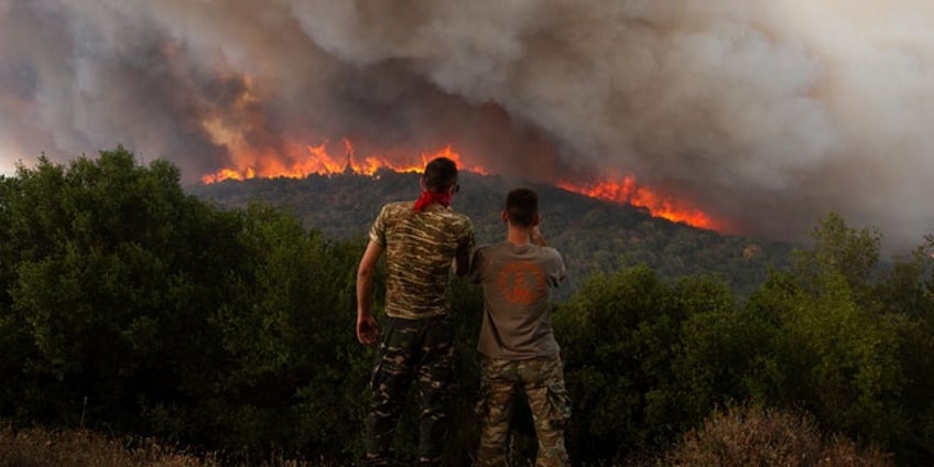 wildfires rage across greece amidst fierce conditions resulting in fatalities and massive destruction