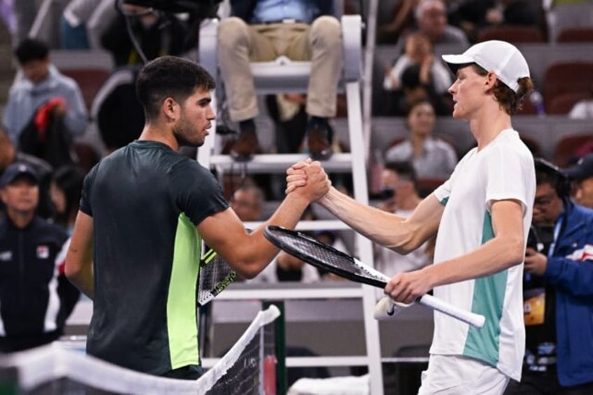 Carlos Alcaraz (L) and Jannik Sinner are the dominant forces in men's tennis
