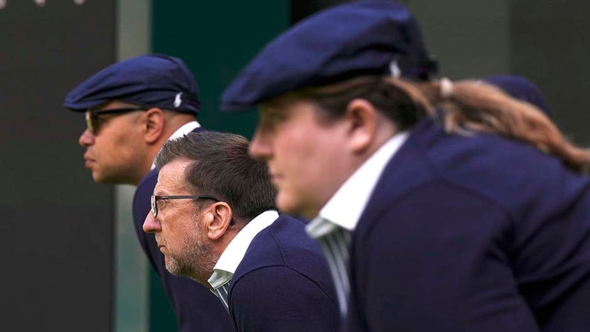 Line Judges look on