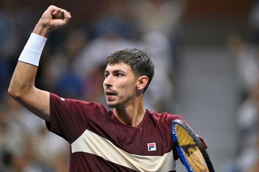 Shock victory: Alexei Popyrin celebrates after winning against Novak Djokovic