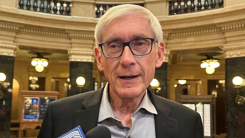 wisconsin gov evers faces scrutiny over use of baseball hall of famers name in state email