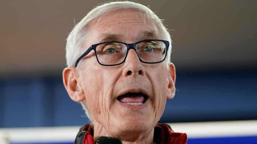 wisconsin gov evers signs school reading overhaul into law