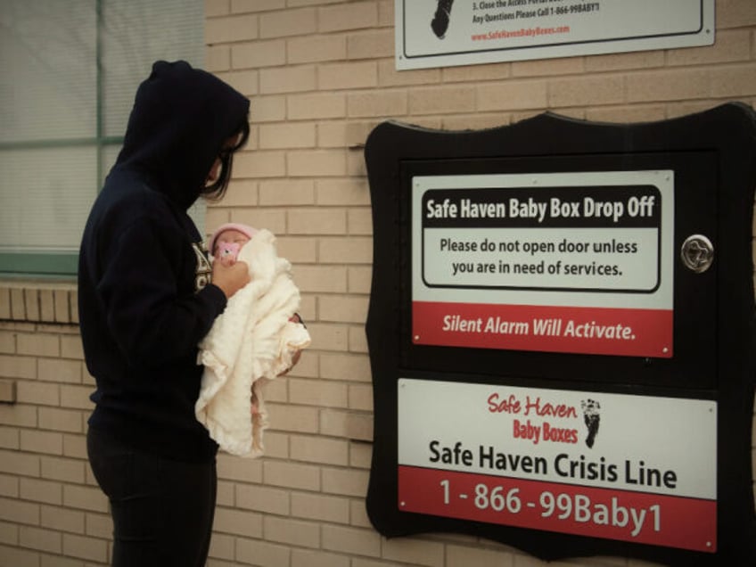 wisconsin governor signs safe haven baby box law for anonymous infant surrender