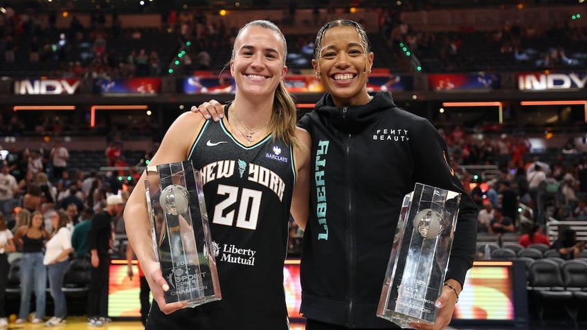 WNBA STARRY 3-Point Contest winner Sabrina Ionescu #20 of the New York Liberty poses with Kia WNBA Skills Challenge winner Natasha Cloud #9 of the New York Liberty during the 2025 AT&T WNBA All-Star weekend at Gainbridge Fieldhouse on July 18, 2025 in Indianapolis, Indiana. 