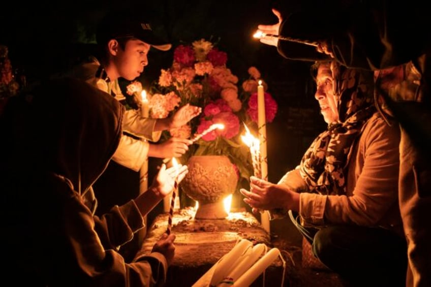 with flowers altars and candles mexicans are honoring deceased relatives on the day of the dead