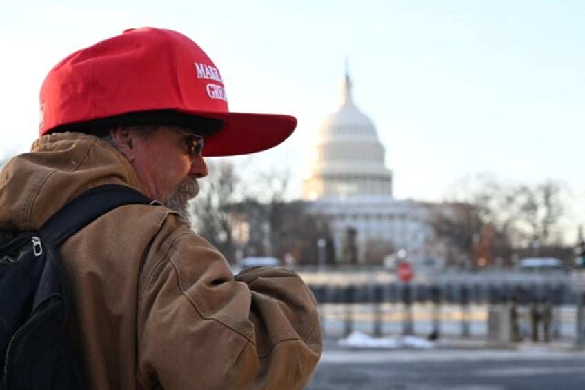 A man wears a MAGA hat near the US Capitol on Inauguration Day