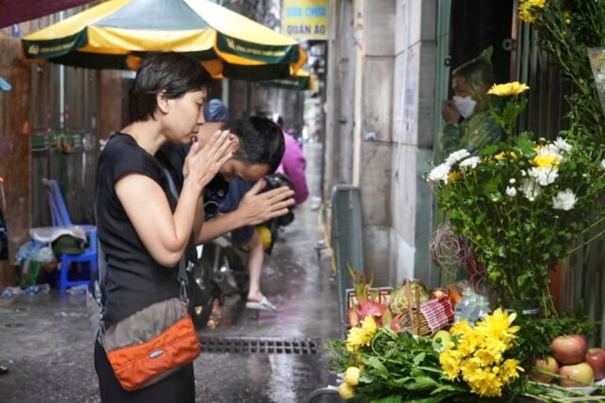 witnesses say victims of a hanoi high rise fire jumped from upper stories to escape the blaze