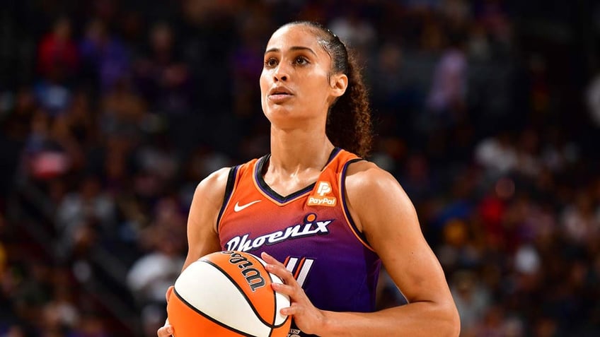 Skylar Diggins-Smith stands on the basketball court