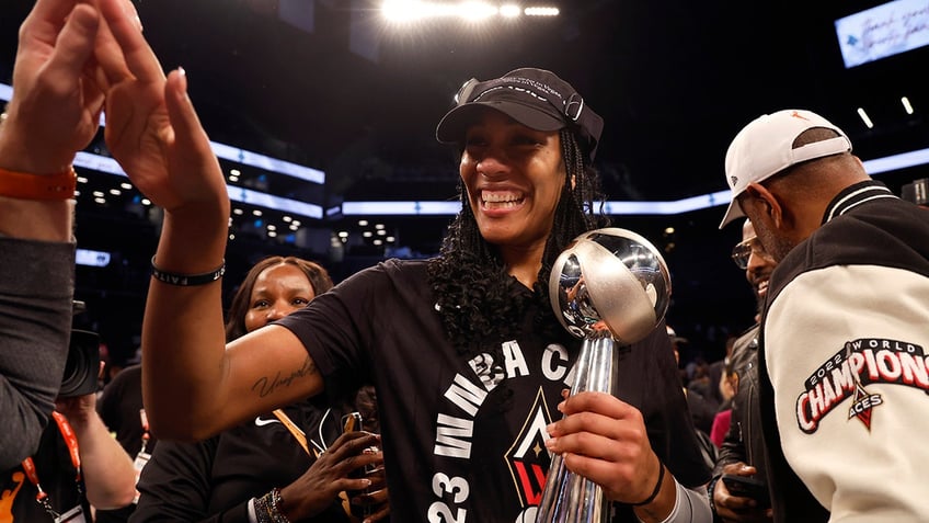 A'ja Wilson holds MVP trophy