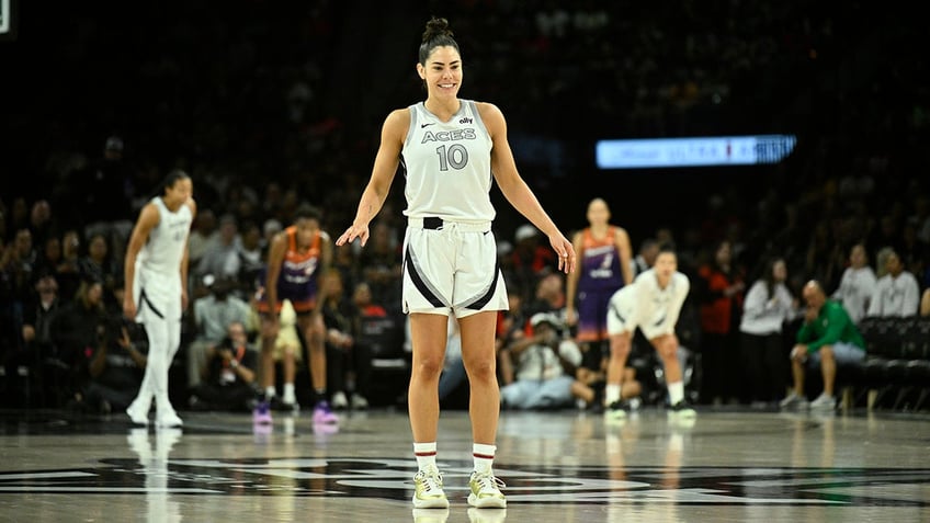 Kelsey Plum smiles in-game