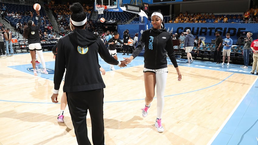 Angel Reese warms up before a game