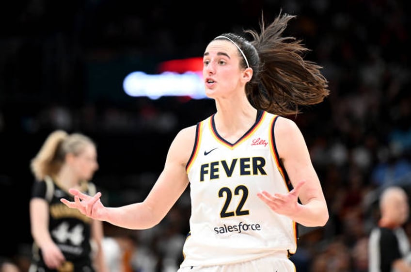 Caitlin Clark of the Indiana Fever reacts to a call in the fourth quarter against the Washington Mystics at Capital One Arena on June 07, 2024 in...