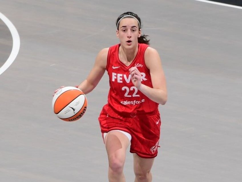 Caitlin Clark #22 of the Indiana Fever handles the ball during the game on August 26, 2024