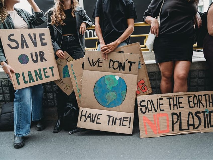 banner signs while they are going to a demonstration against climate change - stock photo