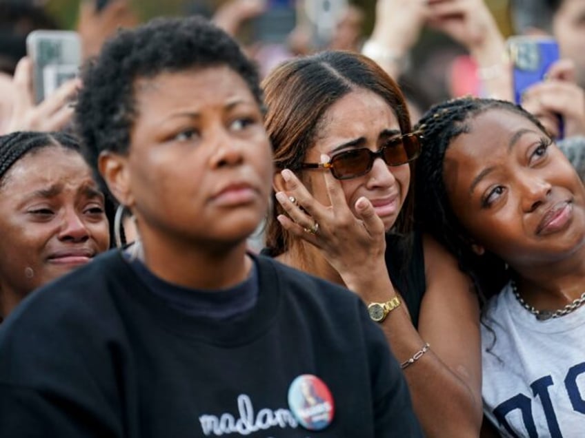 Attendees react as US Vice President Kamala Harris speaks, not pictured, at Howard Univers