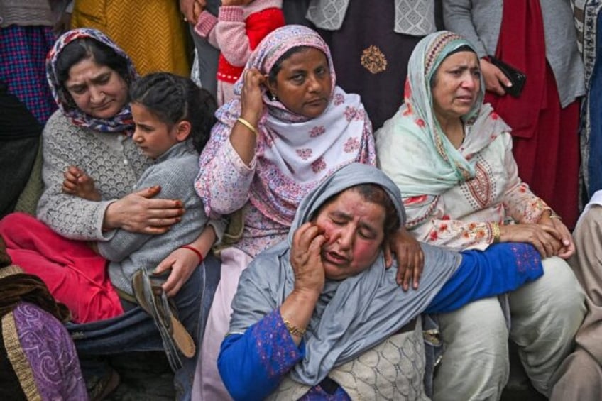 Mourners gather after six people, including five children, were killed when a boat overtur