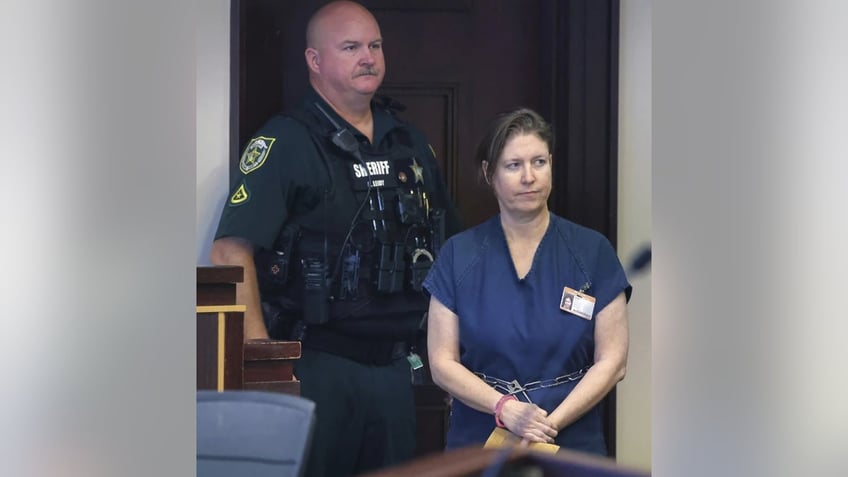 Defendant Sarah Boone leaves the courtroom during a pre-trial hearing in Orlando, Fla., Friday, 