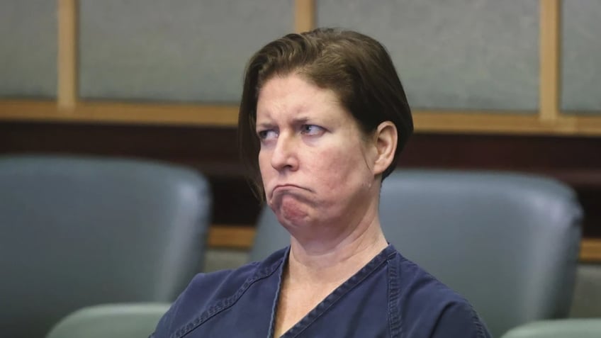 Defendant Sarah Boone listens to her court-appointed attorney Patricia Cashman during a pre-trial hearing in Orlando, Fla., Friday,