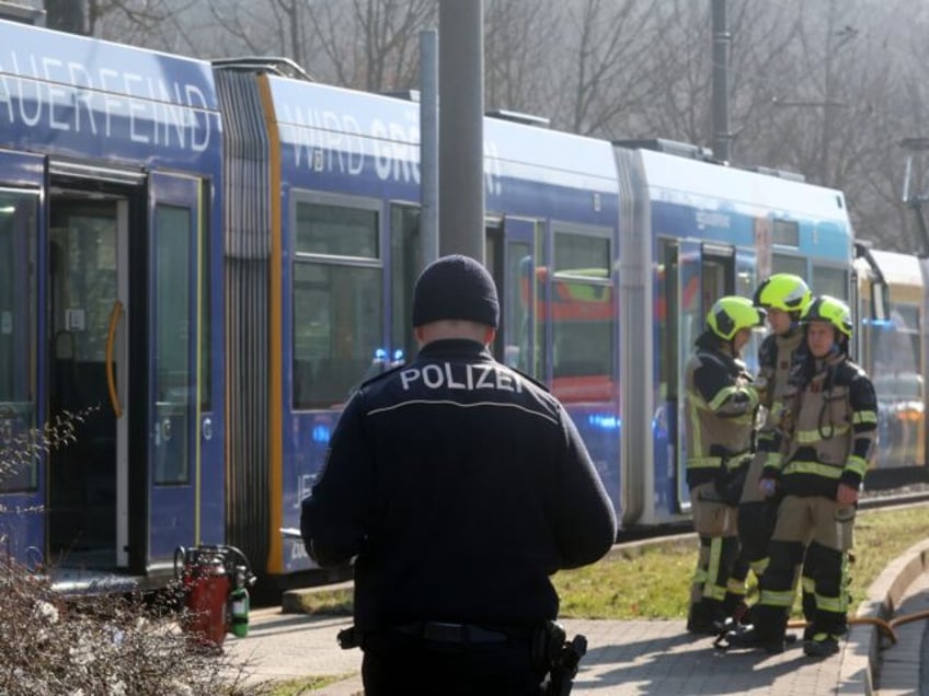 16 March 2025, Thuringia, Gera: Police and firefighters are deployed after an arson attack