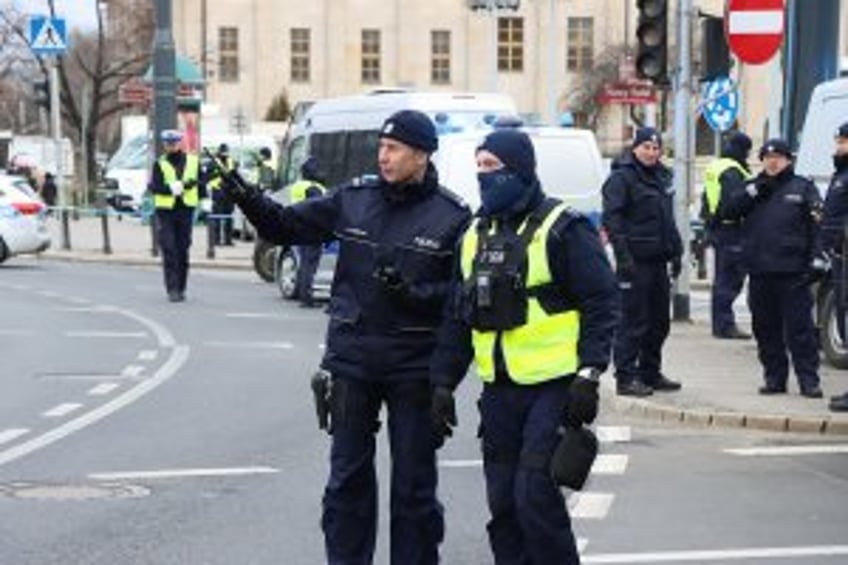 Woman killed, security guard seriously injured in axe attack at Polish university