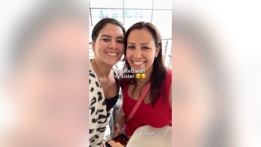 Sisters smiling with bread