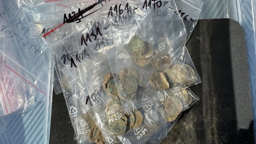 Close-up of coins in plastic bags