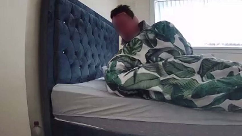 woman unnerved when security footage reveals stranger in her bed i was shocked