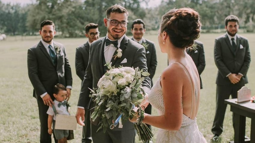 Alexandrea Acevedo and her husband, Michael, pose for photos on their wedding day