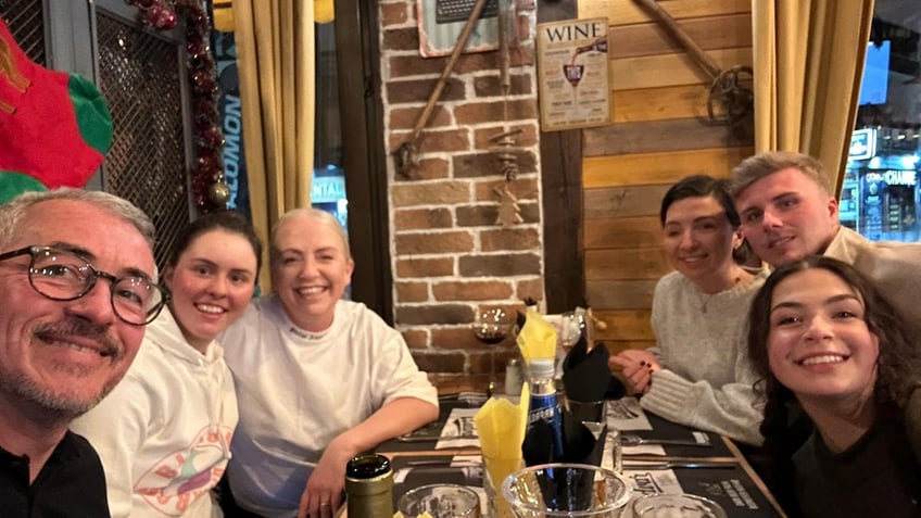 Olivia Corbiere and her family enjoy a meal out after her miraculous recovery.