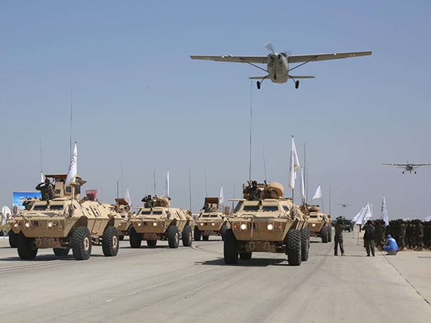 Taliban Military Vehicles are displayed during a military parade to mark the third anniversary of the withdrawal of U.S.-led troops from Afghanistan, in Bagram Air Base in the Parwan Province of Afghanistan, Wednesday, Aug. 14, 2024. (AP Photo/Siddiqullah Alizai)