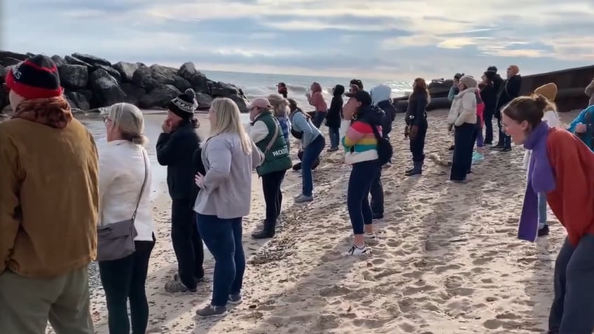 Women standing and screaming