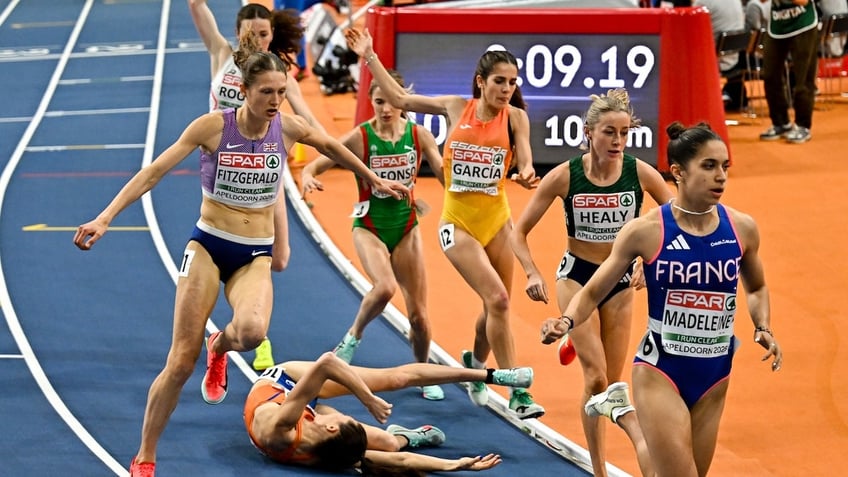 Maureen Koster of Netherlands falls during the women's 3000m final on day four of the European Athletics Indoor Championships 2025 at the Omnisport Apeldoorn in Apeldoorn, Netherlands.