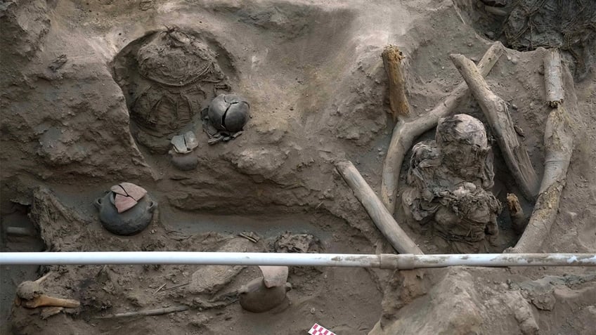 workers uncover 8 mummies and pre inca objects while expanding gas network in peru